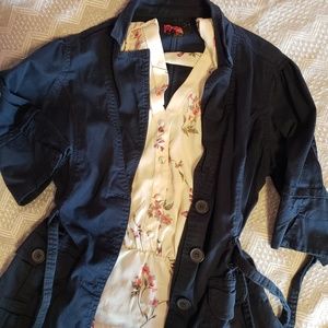 Trendy navy blue peplum style blazer.